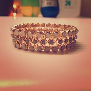Gold and jeweled bracelet